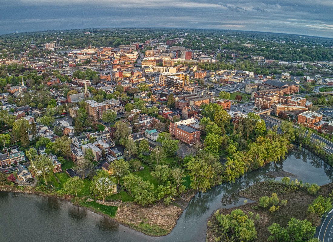 Schenectady, NY - Aerial View of Schenectady, NY With Trees, Buildings and a River